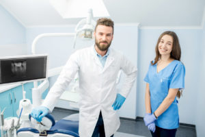 a man and woman in a white coat