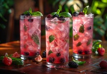 a group of glasses with drinks