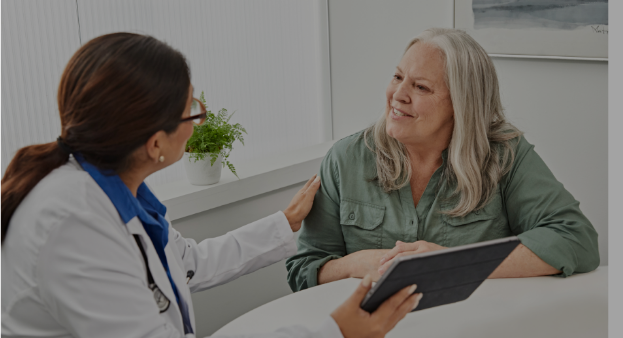 a woman talking to a doctor