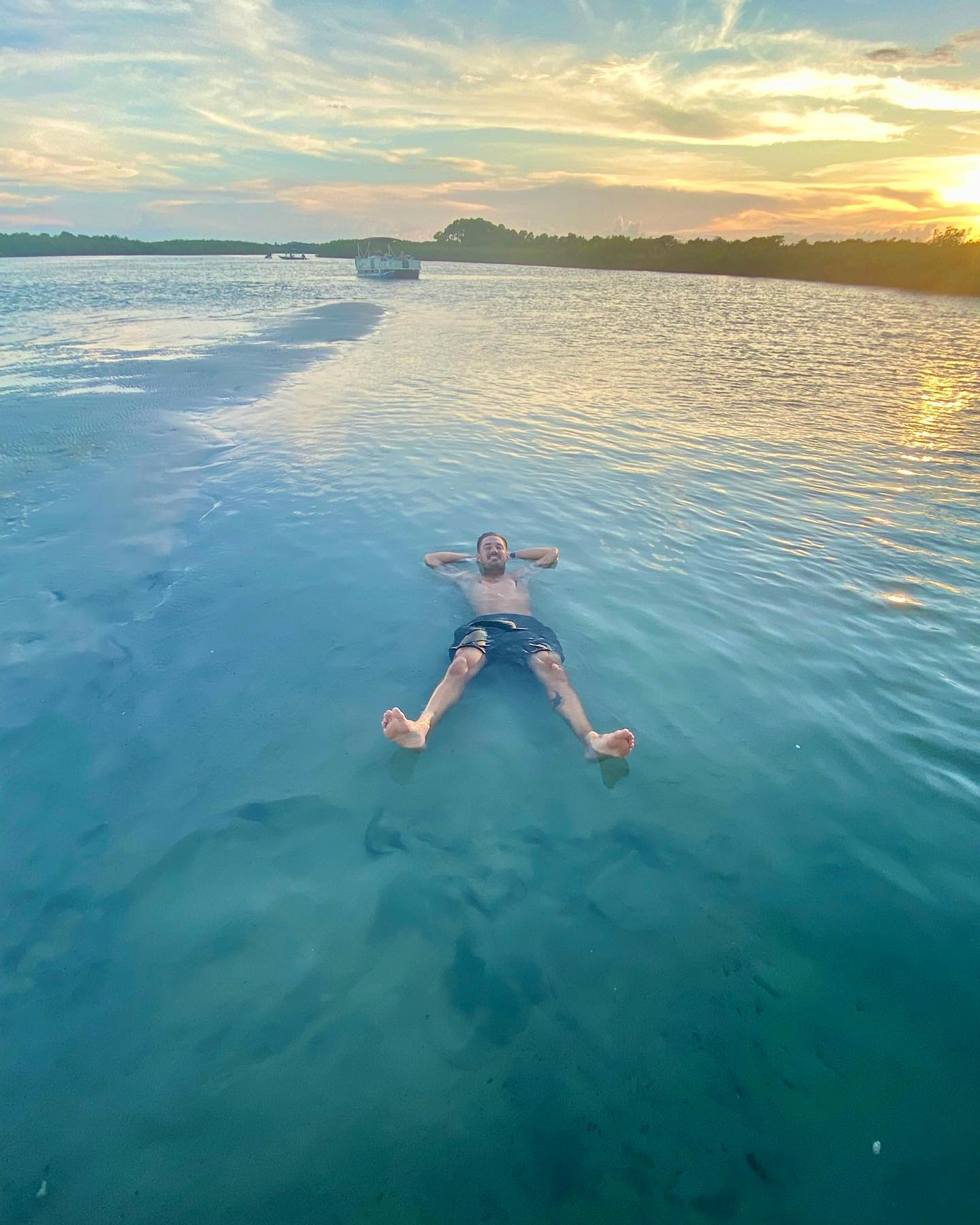 a man lying on his back in the water