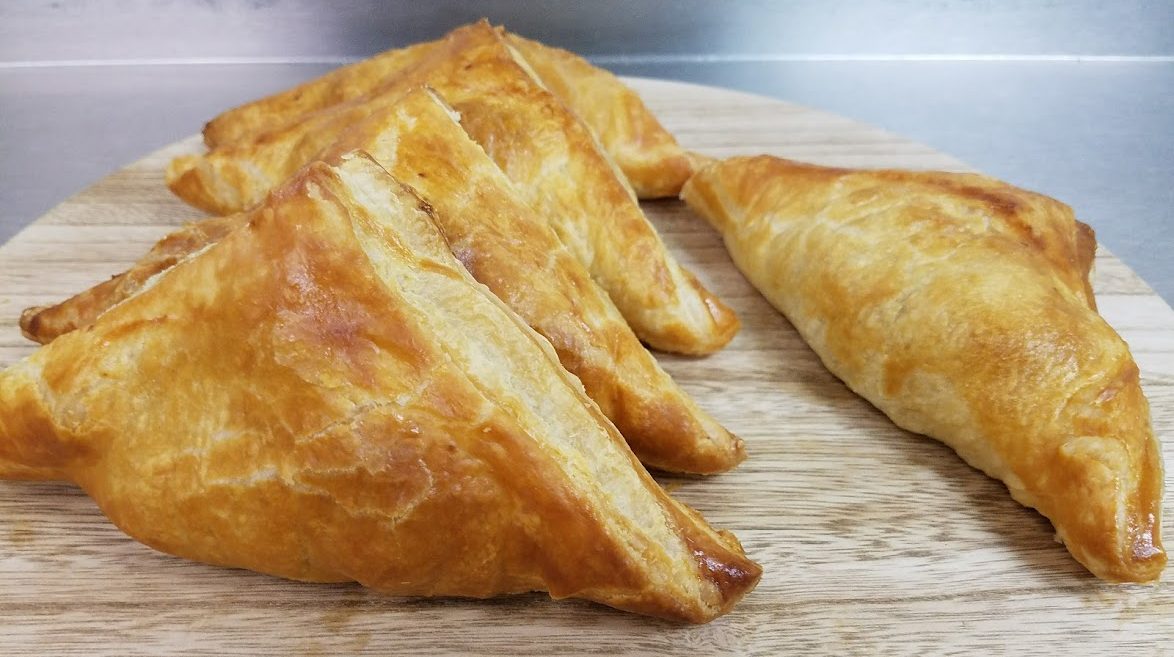 a group of pastries on a wooden surface