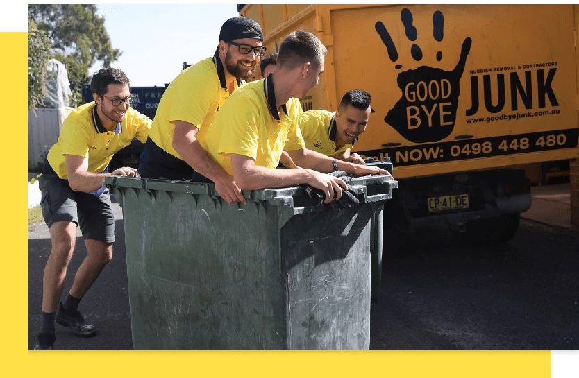 a group of men in yellow shirts pushing garbage cans