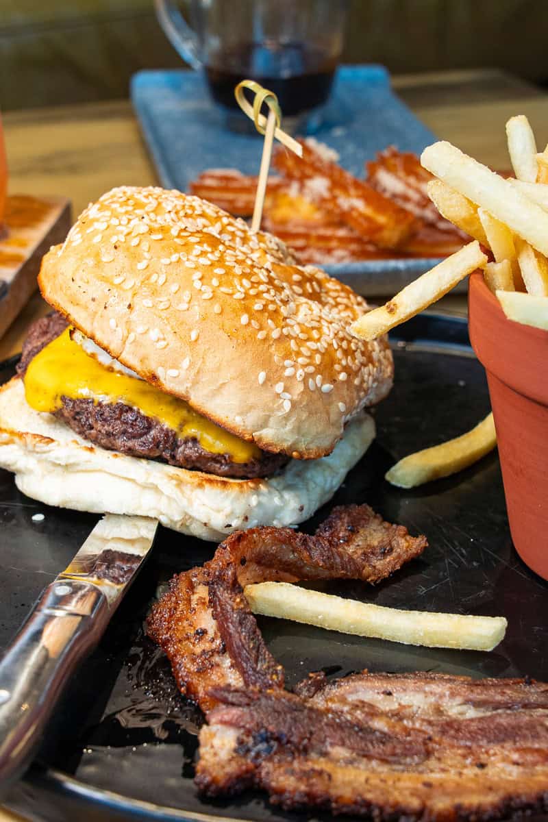 a burger with bacon and fries