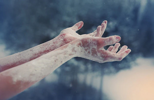 hands covered in white powder