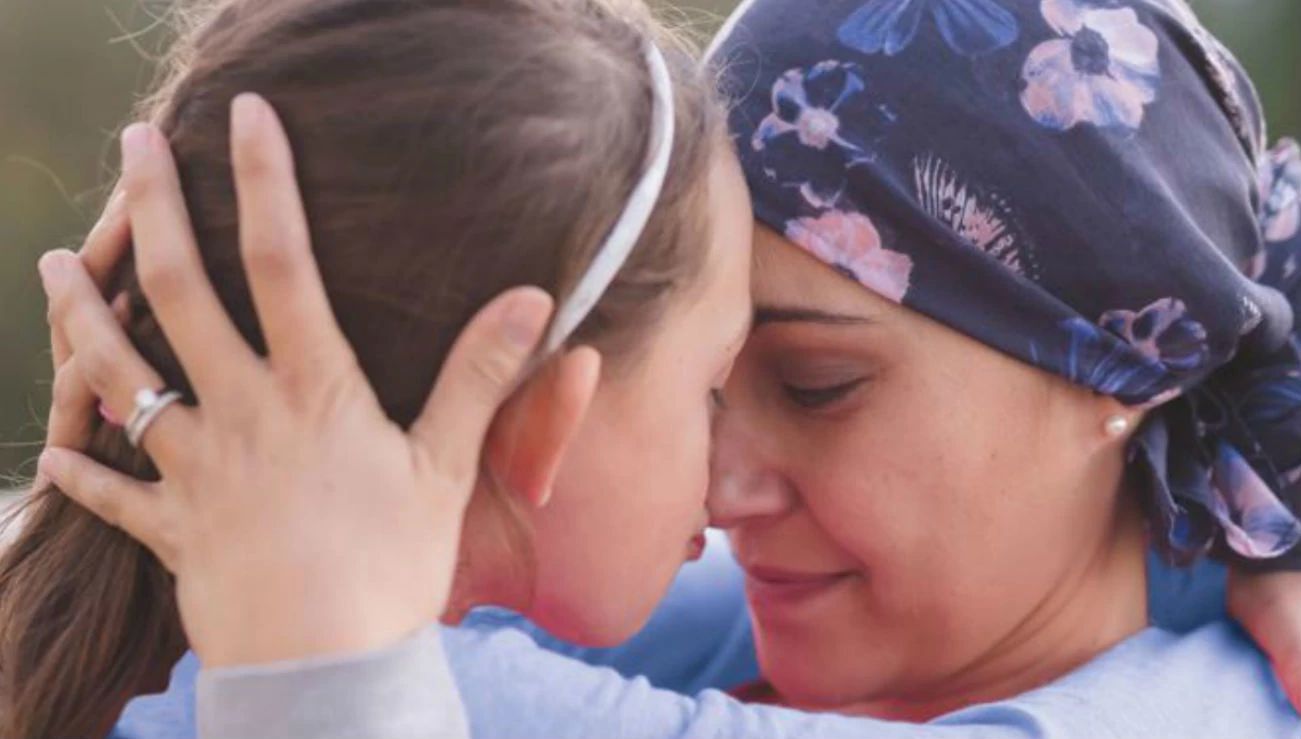 a woman and child touching noses