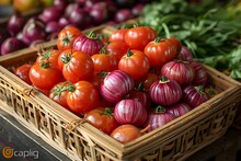 a basket of tomatoes and onions