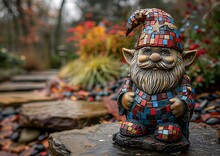 a gnome statue on a rock