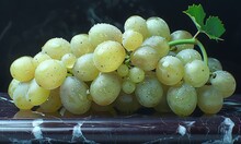 a bunch of grapes on a table