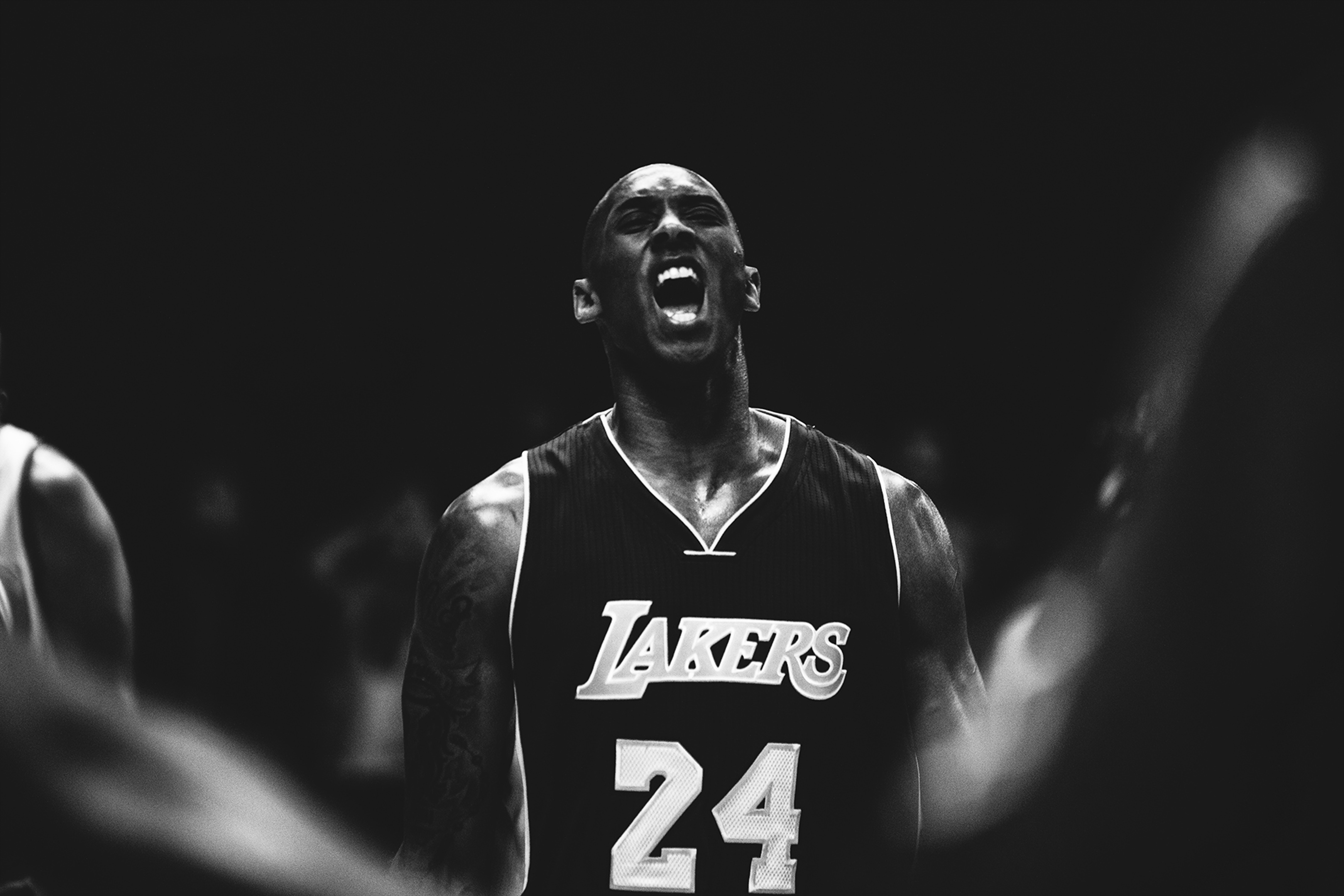 a man in a basketball jersey screaming