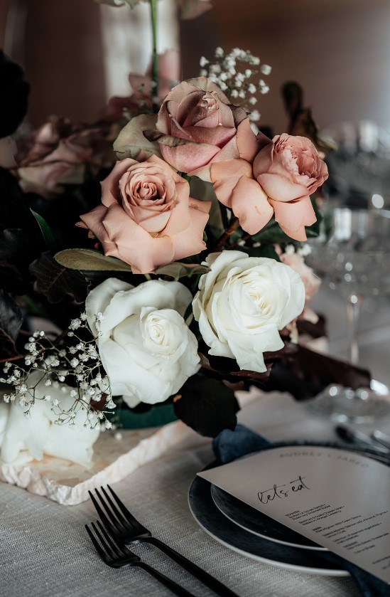 a bouquet of roses on a table