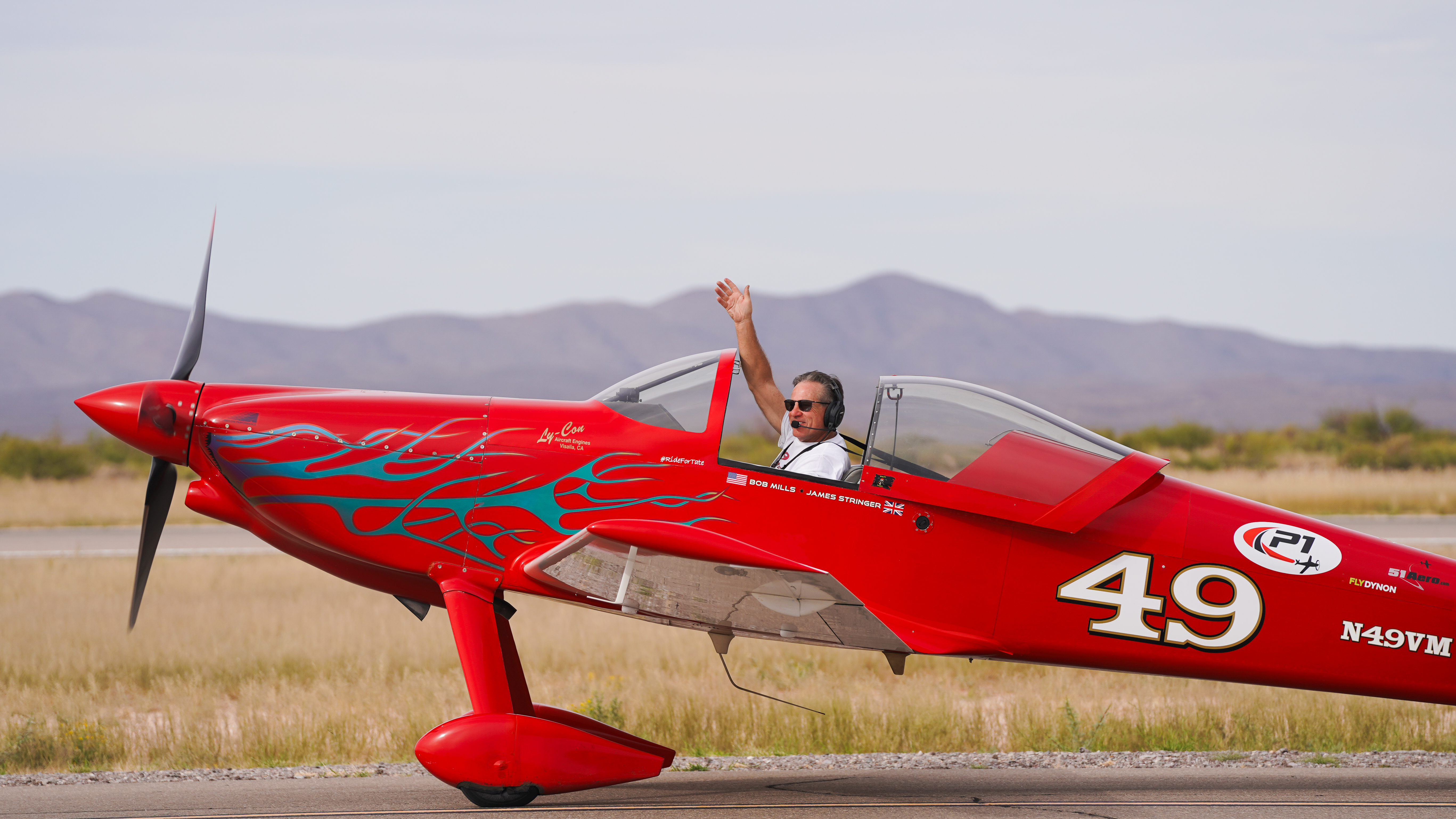 a man in a red airplane