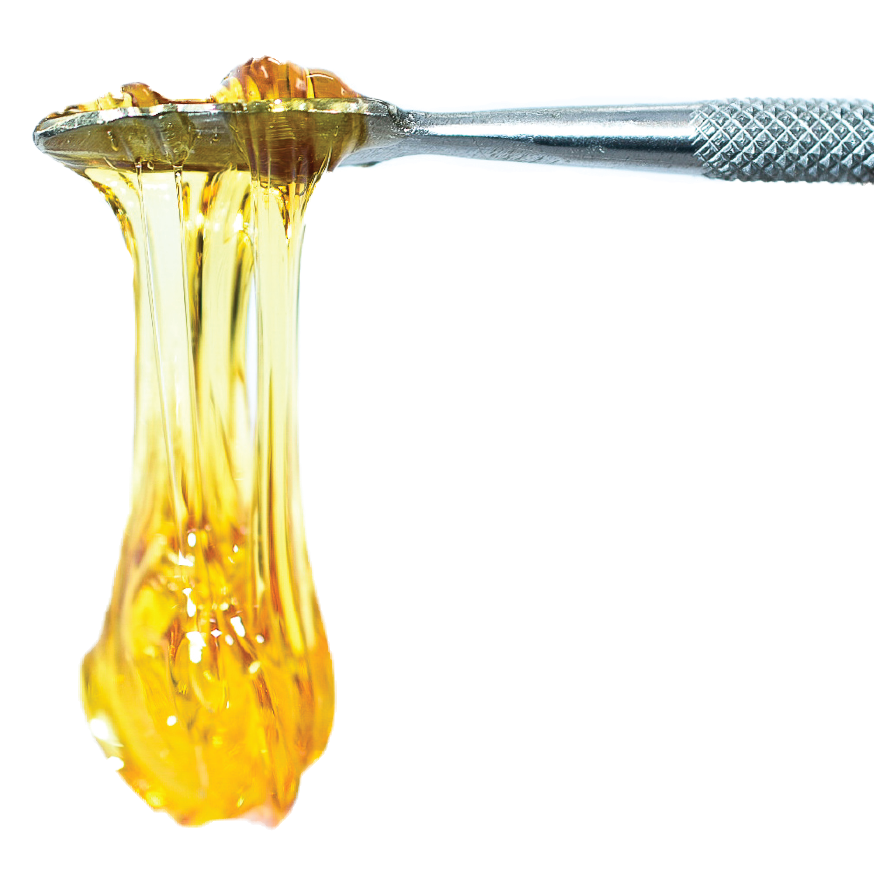 a spoon with a yellow liquid flowing out of it