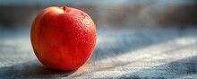 a red apple on a table