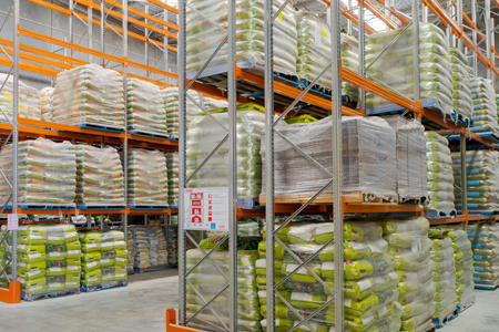 a warehouse with many shelves of goods
