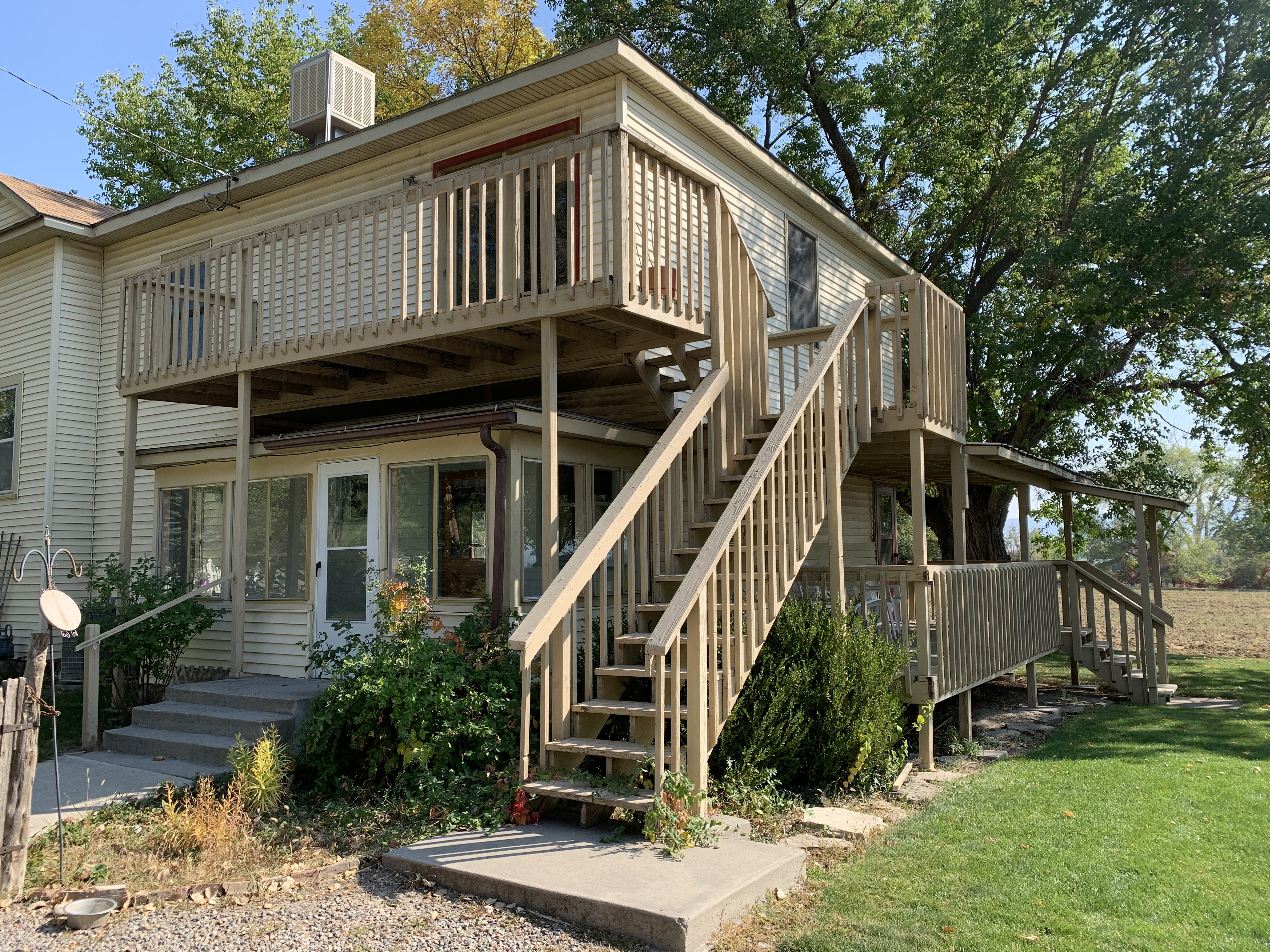 a house with a deck and stairs