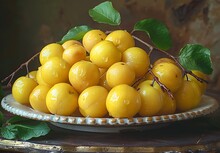 a plate of yellow plums