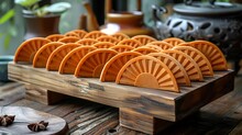 a group of orange circular objects on a wooden stand