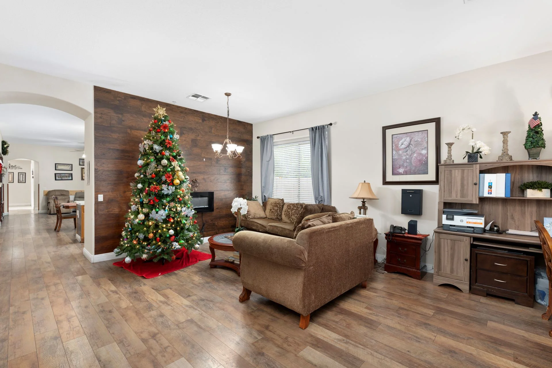 a living room with a christmas tree