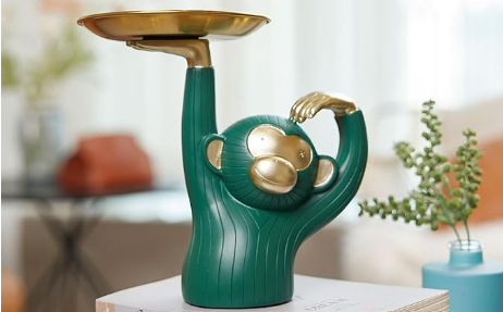 a green and gold monkey statue