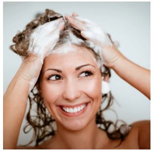 a woman washing her hair
