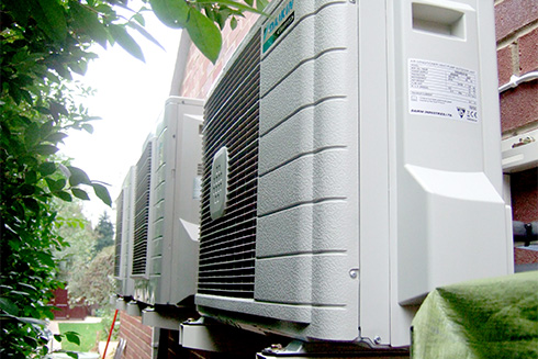 a row of air conditioning units