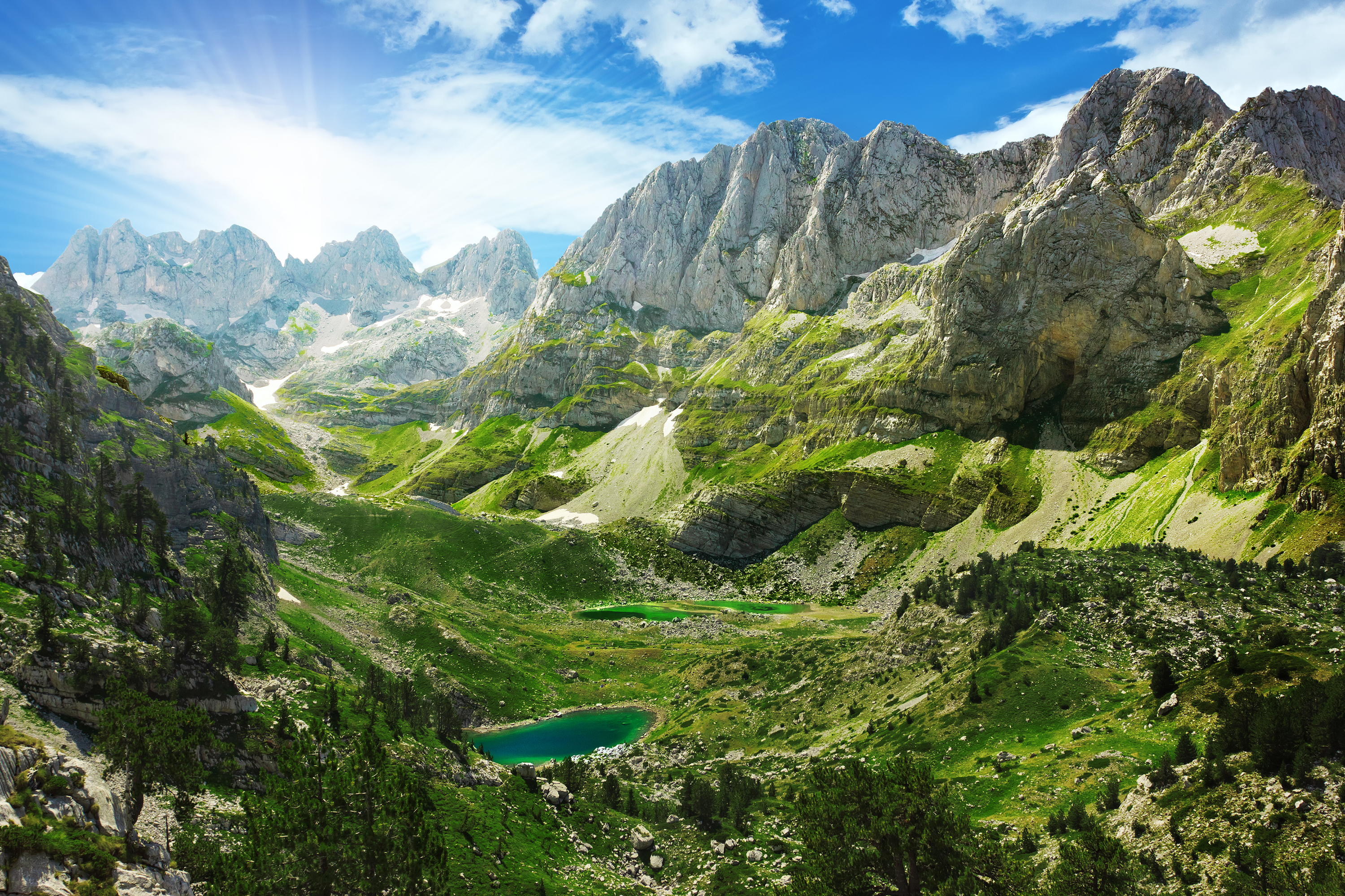 a mountain range with a lake