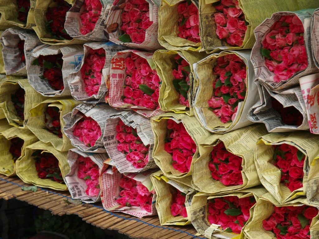 a bunch of flowers in newspaper