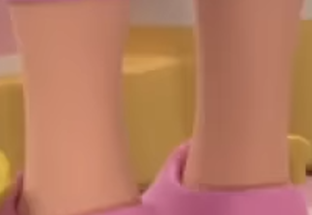 a close up of a doll's legs