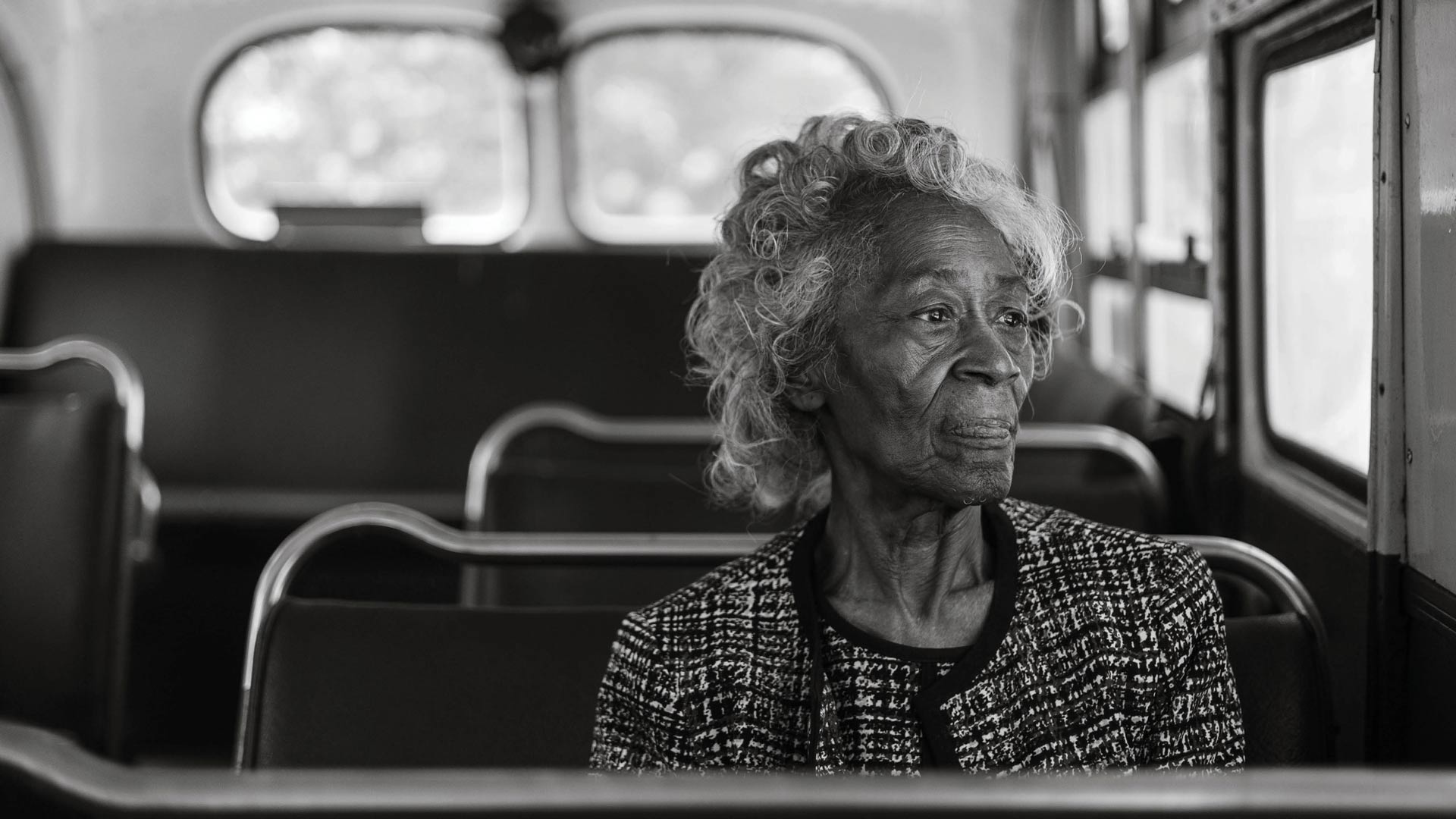 a woman sitting in a bus