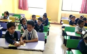 a teacher helping students in a classroom