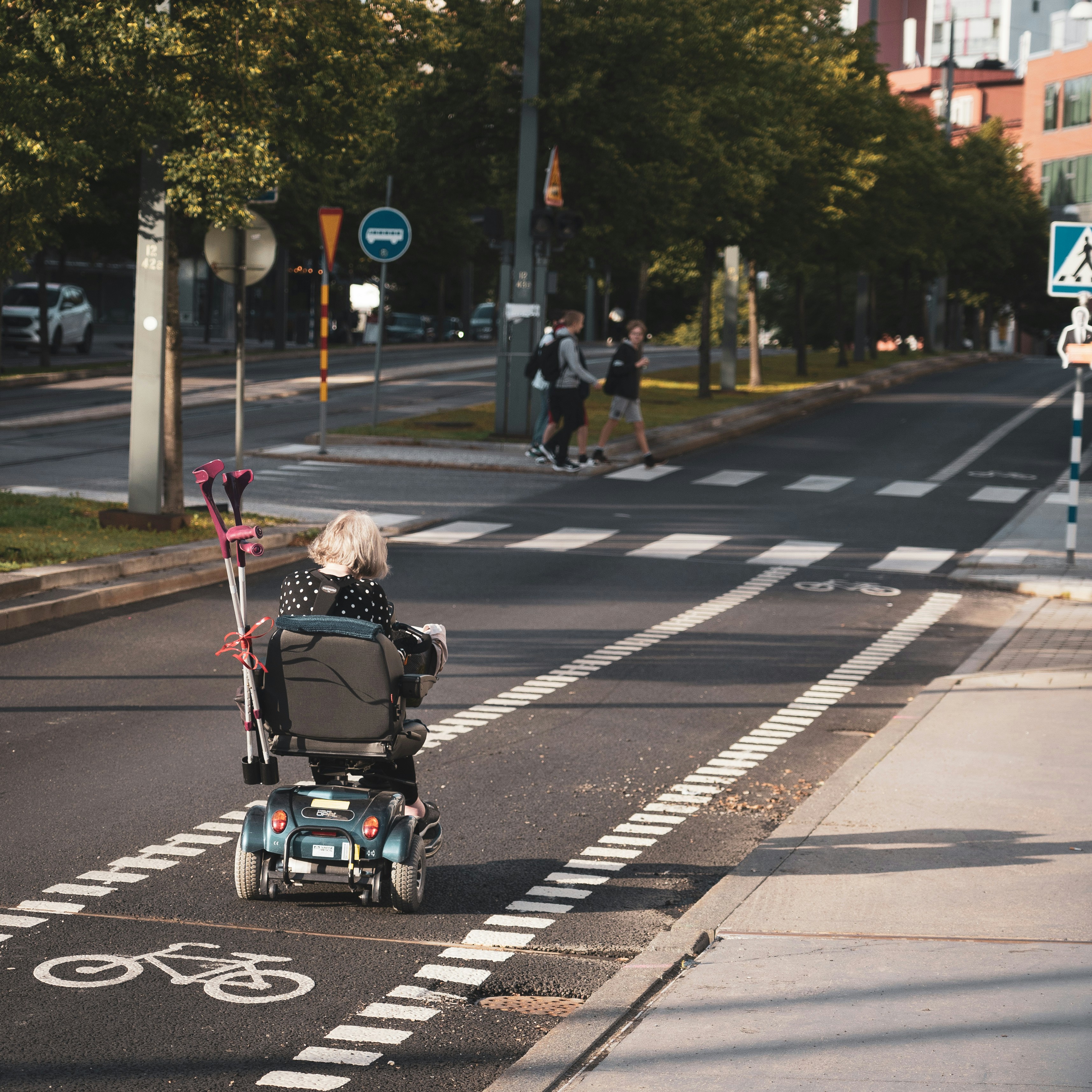 a person in a wheelchair on a street