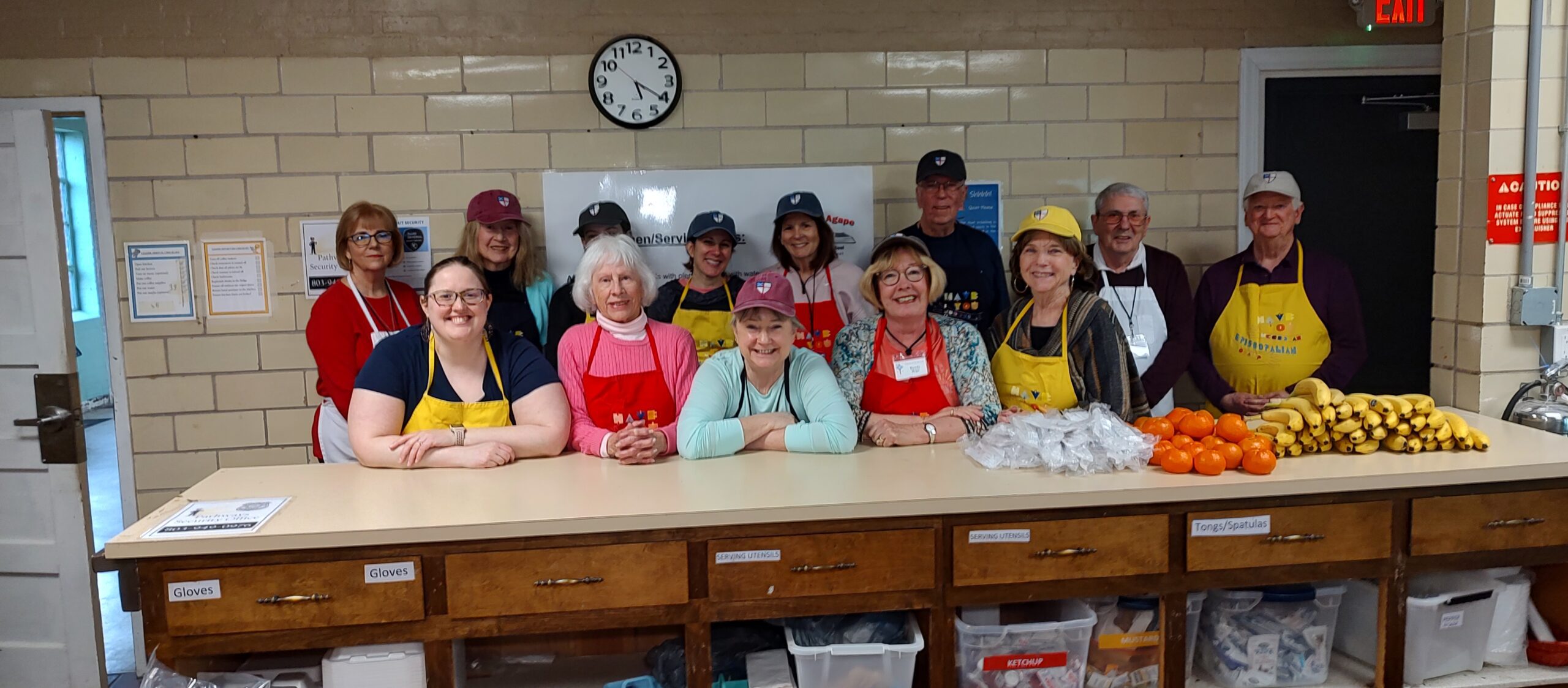 a group of people wearing aprons posing for a photo