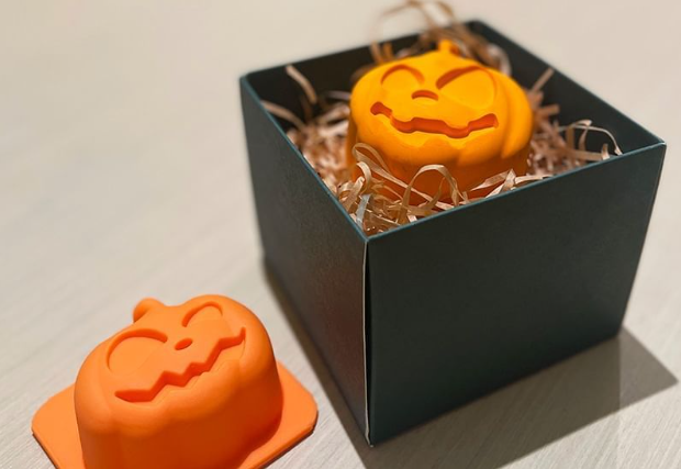 a small orange mold in a box