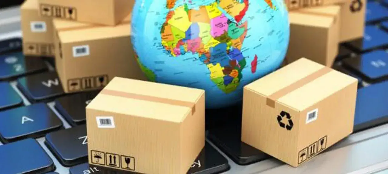 a globe and boxes on a scale