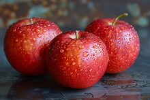 a group of apples with water droplets on them