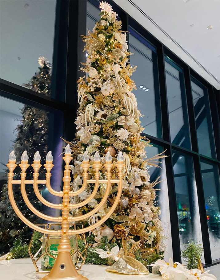 a large gold menorah with a large gold candelabra