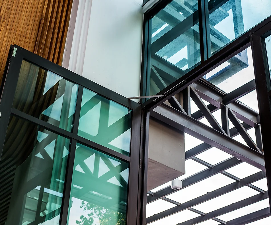 a glass wall with metal railings