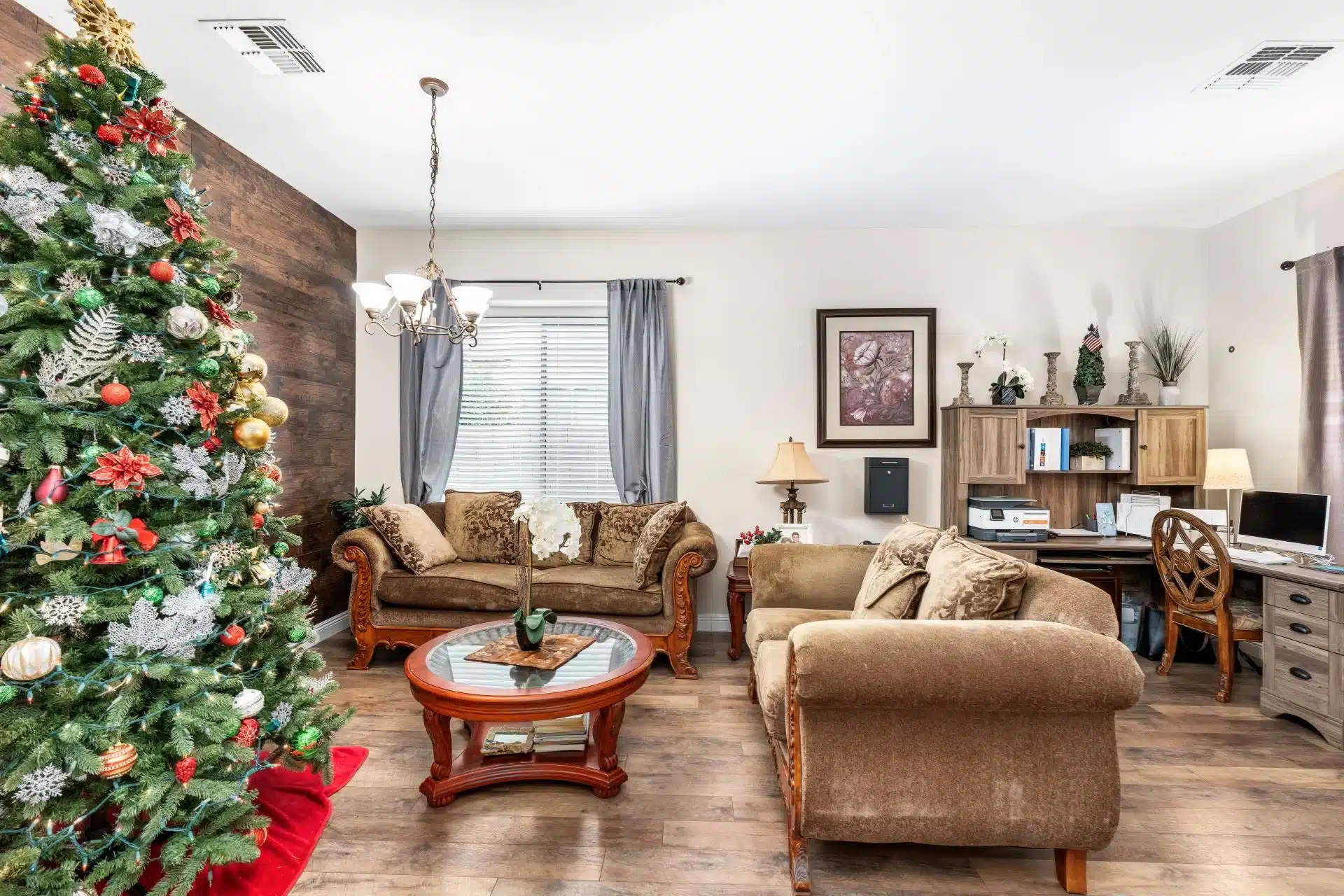 a living room with a christmas tree and a christmas tree