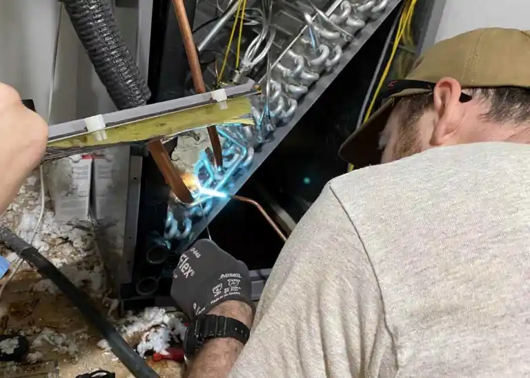 a man welding a piece of metal