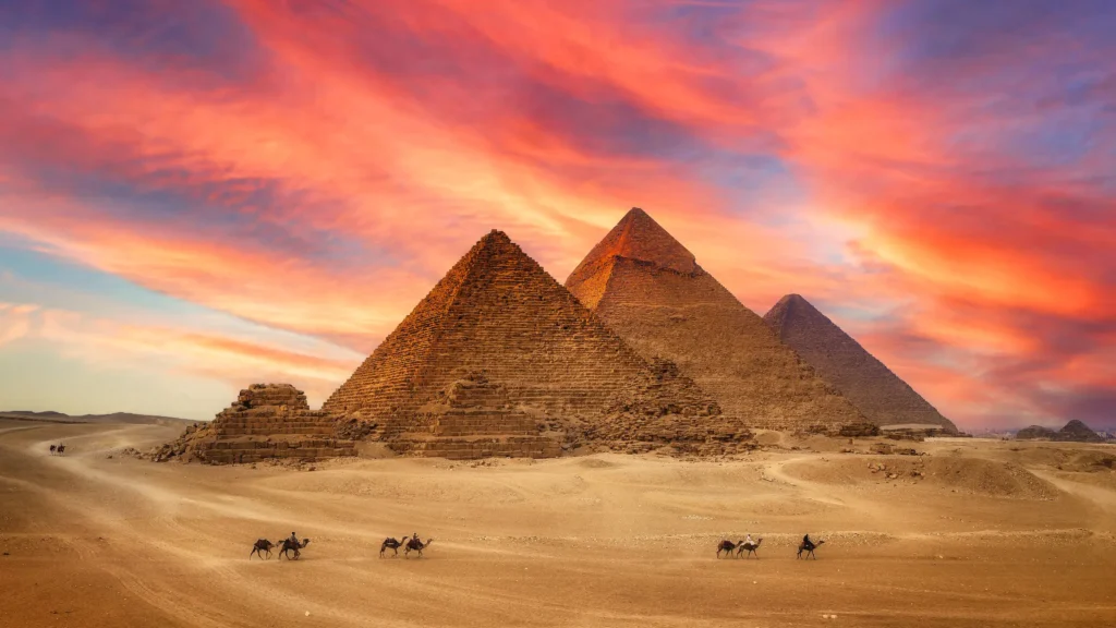 a group of pyramids in the desert