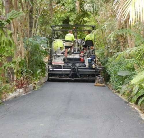 a group of men working on a road