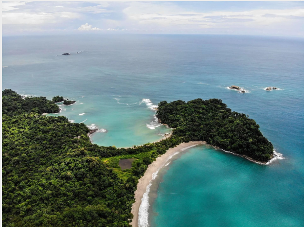 an aerial view of a beach and islands