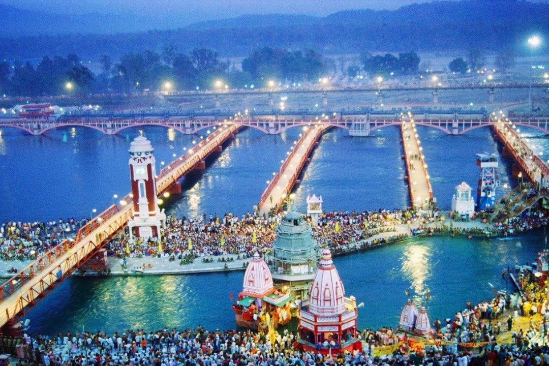 a large crowd of people on a bridge over water