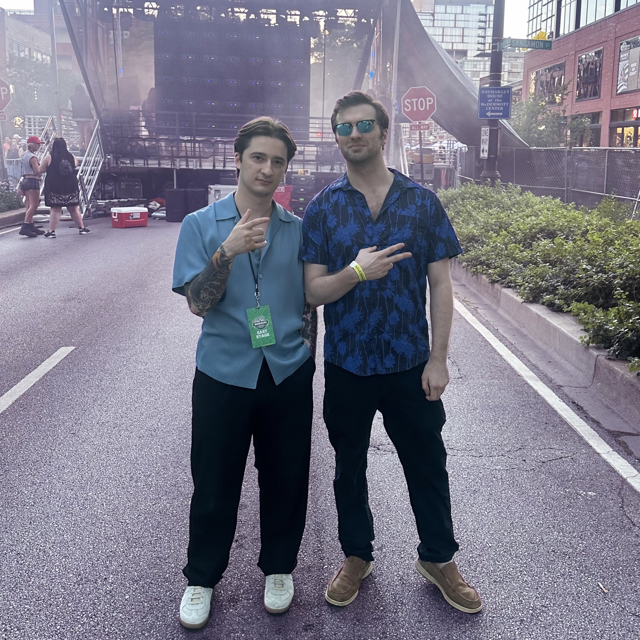 two men standing on a street