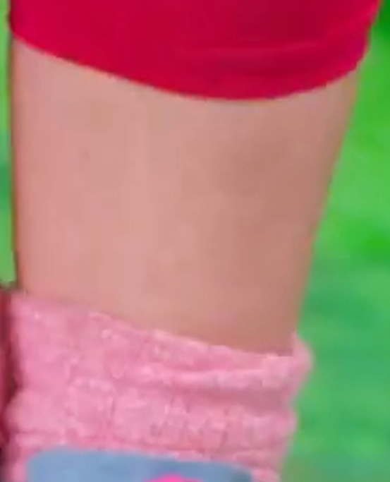 a person's arm with a pink sleeve