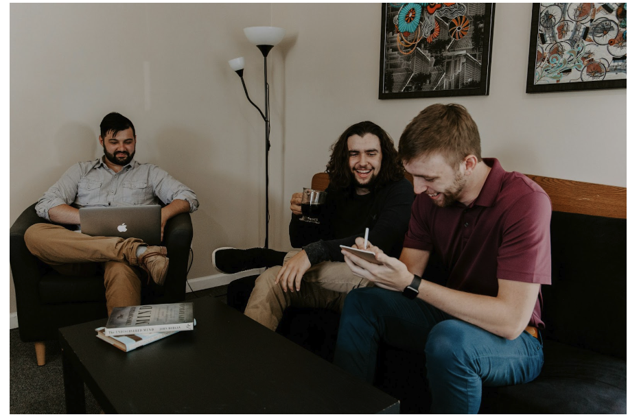 a group of men sitting on couches