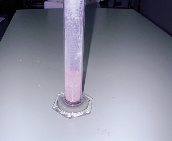 a test tube with a purple substance