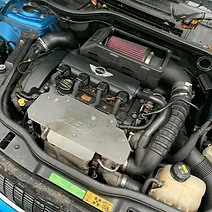 a car engine with a blue hood