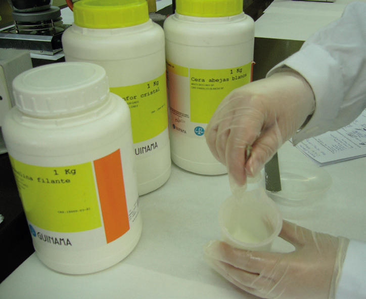 a person pouring a substance into a container