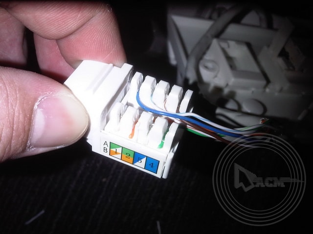 a person holding a white electrical device